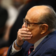 U.S. President Donald Trump’s personal attorney Rudy Giuliani waits to testify before the Michigan House Oversight Committee on December 2, 2020 in Lansing, Michigan.